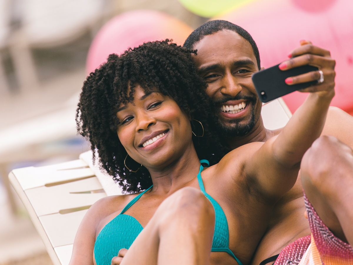 Couple at a pool. Vacation your way. Discover the benefits of timeshare membership. 