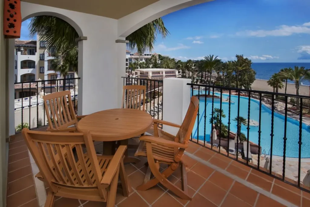 Balcony seaside view from Marriott’s Playa Andaluza, showcasing the pool, beach, and ocean