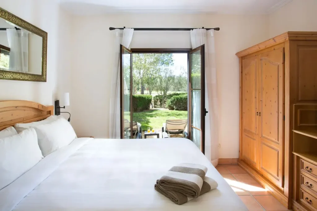 Cozy bedroom with garden view at Marriott’s Club Son Antem, Mallorca, Spain.