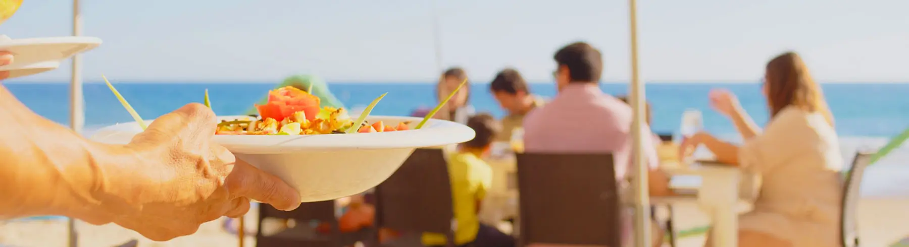 Outdoor dining experience in Mallorca with a view of the beach